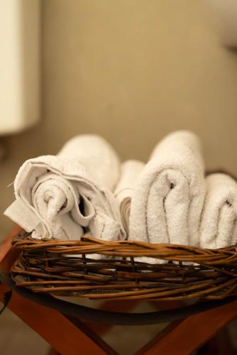 a basket filled with towels on top of a table at Yellow Cardinal Lodge in Curuzú Cuatiá