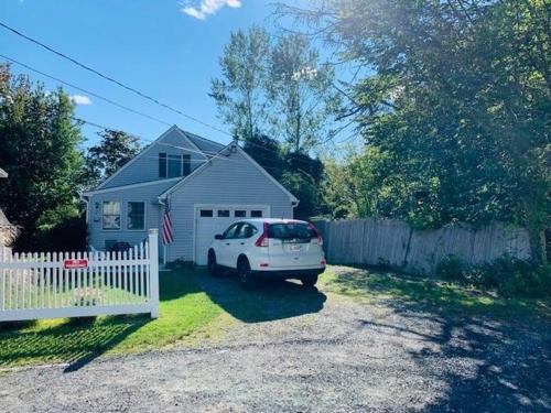 a white car parked in front of a house at Family Retreat at York Beach in York
