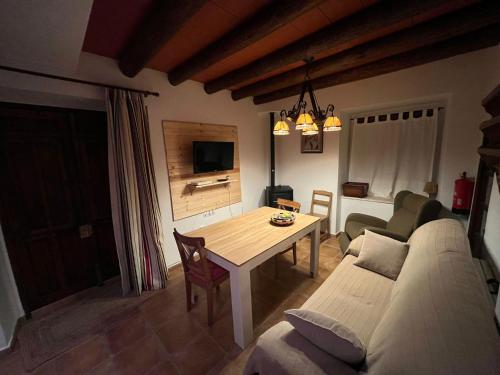 a living room with a couch and a table at Casa rural Palotes in Nerpio