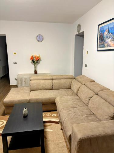 a living room with a large couch and a table at Luino Family Retreat in Luino