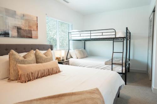 a bedroom with two bunk beds and a ladder at Beehive Getaway in Salt Lake City