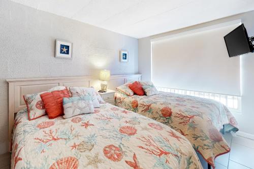 Ένα ή περισσότερα κρεβάτια σε δωμάτιο στο Polynesian 503