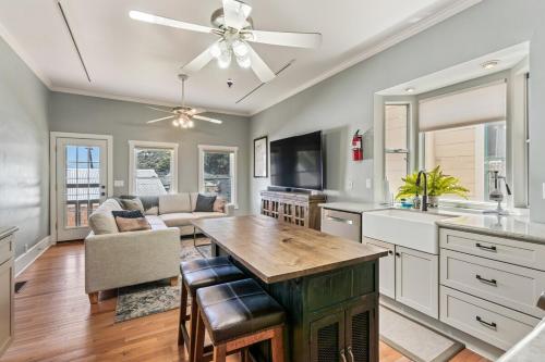 a kitchen and living room with a ceiling fan at Copper Queen Retreat in Bisbee
