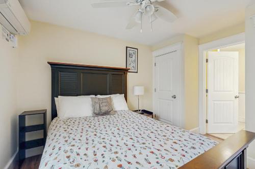 a bedroom with a bed and a ceiling fan at The View II at Sheepscot River in Fort Edgecomb