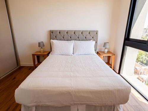 Ένα ή περισσότερα κρεβάτια σε δωμάτιο στο Bright and Stylish 1BR Apt near Shopping del Sol