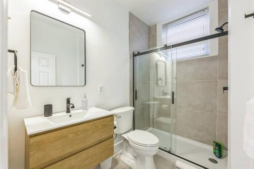 a bathroom with a toilet and a sink and a shower at New Studio in Center City that Sleeps 4 with Fast Wifi in Philadelphia