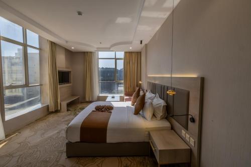 Postel nebo postele na pokoji v ubytování Armada Residence Hotel