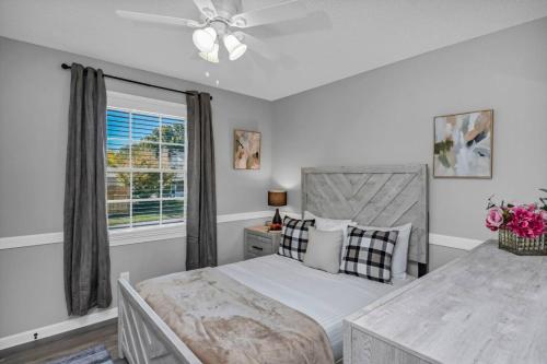 a bedroom with a bed and a window at Lexington Leisure House- 4BR in Lexington