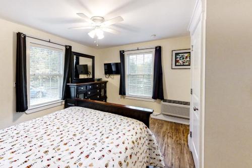 a bedroom with a bed and a ceiling fan at The View at Sheepscot River in Fort Edgecomb