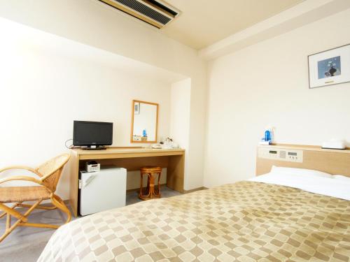 Postel nebo postele na pokoji v ubytování Hotel Trend Nagano