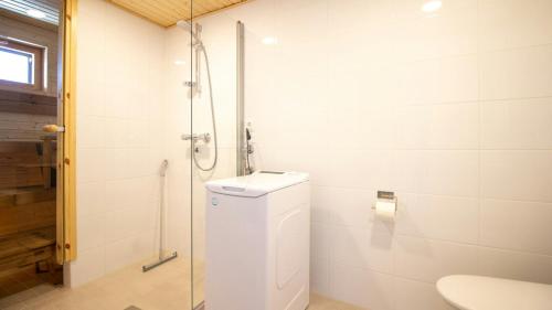 a bathroom with a toilet and a shower at Convenient Apartment for 4 with Sauna in Espoo