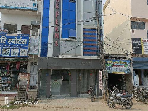 a motorcycle parked in front of a building at Hotel O The Ferns in Thānesar