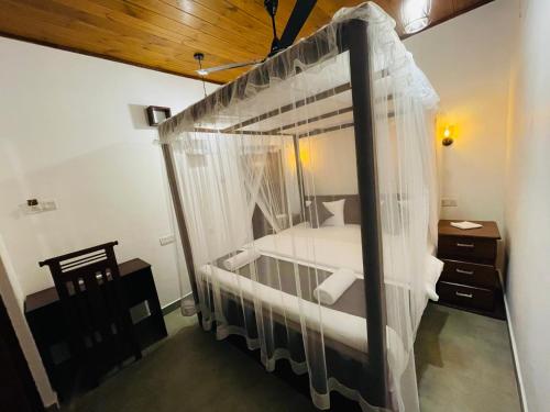 Postel nebo postele na pokoji v ubytování Alice House Hiriketiya