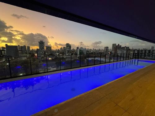 a swimming pool with a view of the city at Tolive One - Ilha do Leite, Recife in Recife