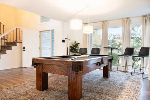 a living room with a pool table in it at Cozy & Elegant Gem Fenced Yard BBQ & Games in Omaha