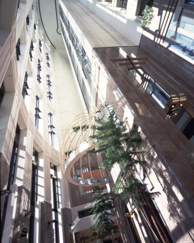 a view of a building with plants in a hallway at Kurashiki Royal Art Hotel in Kurashiki