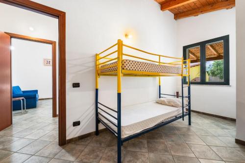 Postel nebo postele na pokoji v ubytování Residence Sulcis 3
