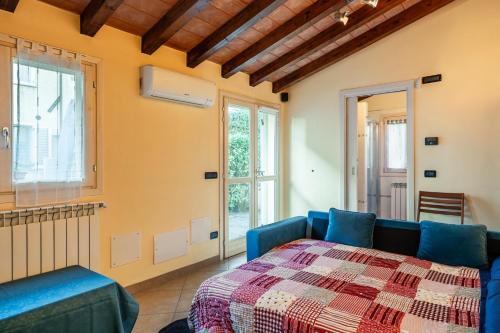 a living room with a bed and a window at Residence Al Pozzo in Capannori