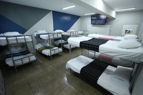 a room with a bunch of bunk beds in it at Hostel Oficial COP30 in Belém