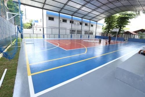 a basketball court inside of a building at Hostel Oficial COP30 in Belém