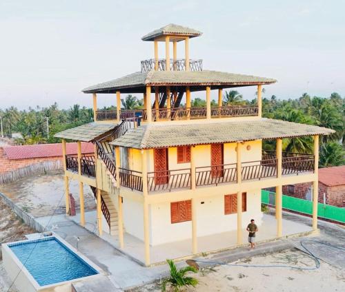 een uitzicht op een huis met een zwembad bij Casa da Duna Moitas-Icaraizinho de Amontada Ceará in Praia de Moitas