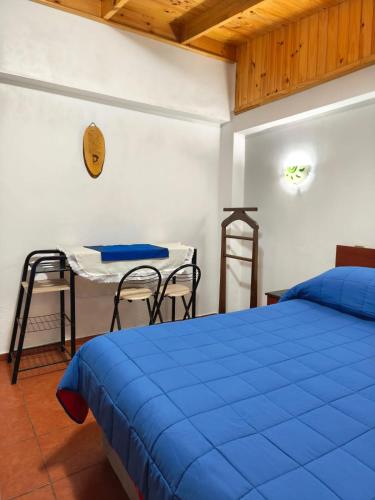 En eller flere senge i et værelse på Hostal Julia