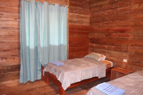 Ένα ή περισσότερα κρεβάτια σε δωμάτιο στο Wasi ñusta Yaku