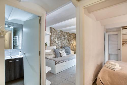 a small bedroom with a bed and a bathroom at Old Side Girona two in Girona