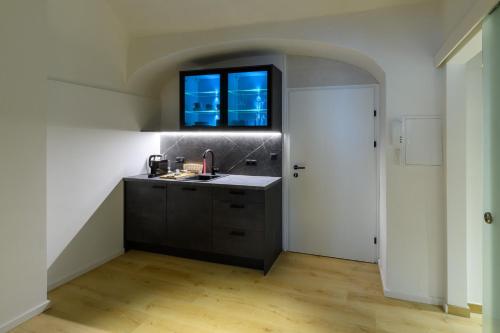 a kitchen with a sink and a window at Gh Alte Post - Top 6 Ascona in Gmünd in Kärnten
