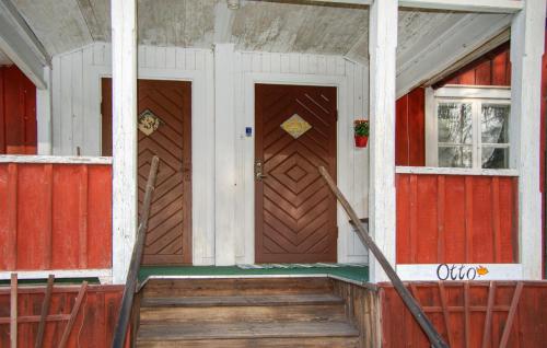 a front door of a red and white house at Pet Friendly Home In Kopparberg With Lake View in Kopparberg