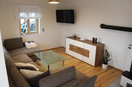 a living room with a couch and a table at Weingartenhaus in Leutschach