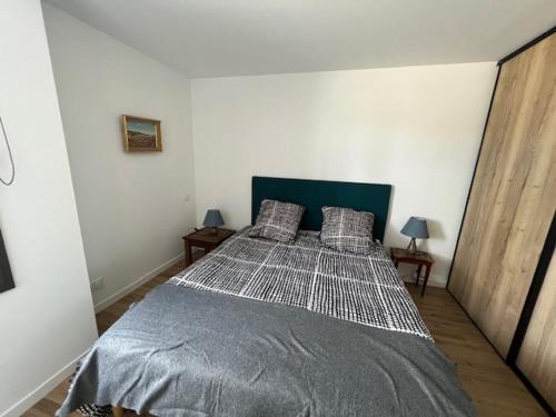 Ένα ή περισσότερα κρεβάτια σε δωμάτιο στο 200m de l'Océan