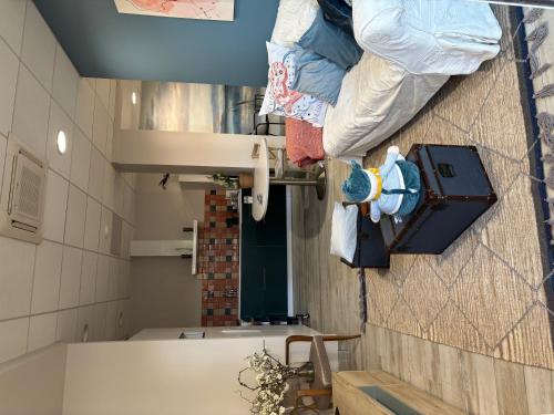 a bathroom with a sink and a toilet in a room at Appartement Calina in Freyming