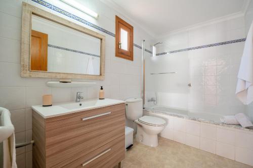 a bathroom with a sink and a toilet and a shower at Apartamentos Karin 1ºc in Cala d´Or