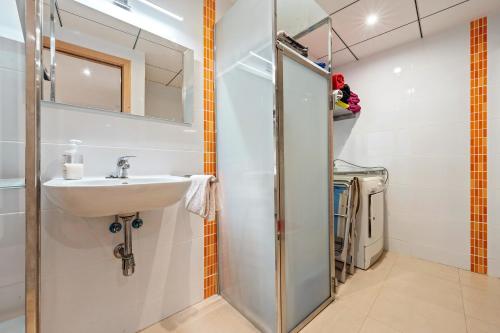 a bathroom with a sink and a mirror at Viudelta in Sant Jaume d'Enveja