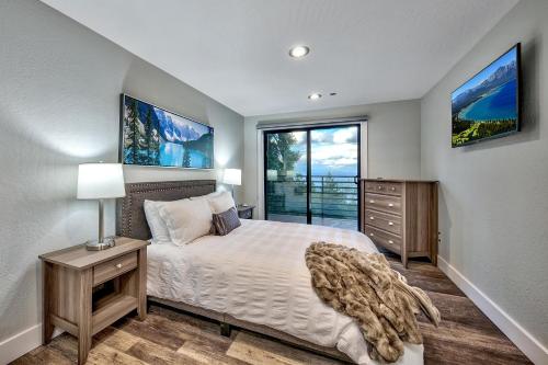 a bedroom with a bed and a large window at LUXE 11 Blue Diamond Lodge Lake Tahoe in Stateline