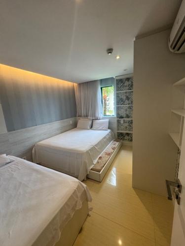 Flat Marulhos Resort - Porto de Galinhas房間的床