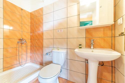 a bathroom with a toilet and a sink at Arianna Studio 16 in Paleokastritsa