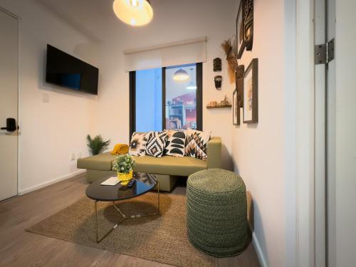 a living room with a couch and a table at Loft in the Heart of the Historic Center in Mexico City