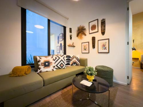 a living room with a couch and a table at Loft in the Heart of the Historic Center in Mexico City