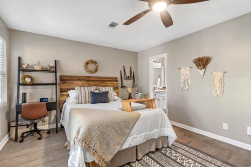 a bedroom with a bed and a ceiling fan at Lakeside Lodge on Bluegill- Arcade, Dock, FirePit in Eatonton