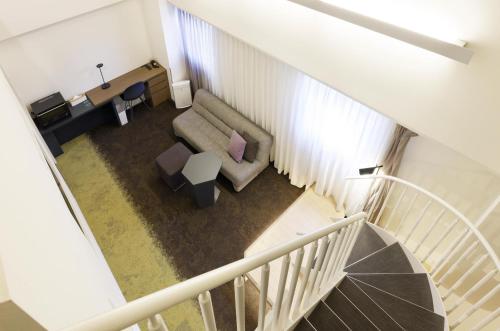 an overhead view of a living room with a couch at Holiday Inn & Suites Sapporo Odori Park by IHG in Sapporo