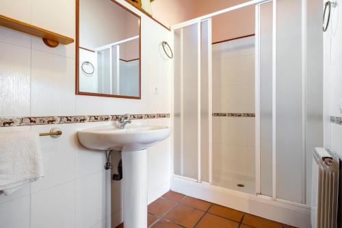 a bathroom with a sink and a shower at La Xaconera in Catllar