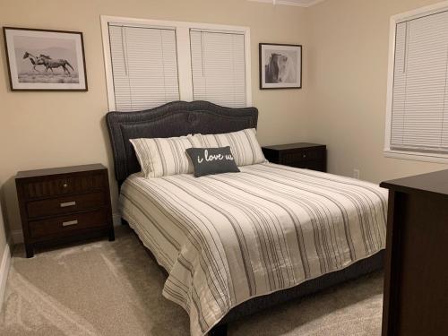 a bedroom with a bed and two night stands at Little Sunshine in Ocala