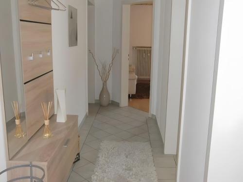 a hallway with a vase of flowers in a room at Ferienwohnung Uli Schätzle in Hornberg