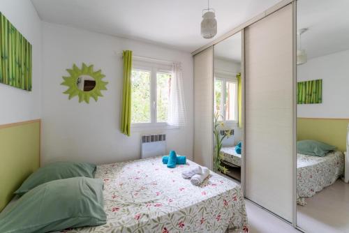 Postel nebo postele na pokoji v ubytování P'tit Bout de paradis