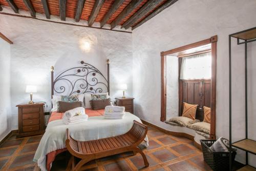 a bedroom with a large bed and a window at Casa Pedro in Icod de los Vinos