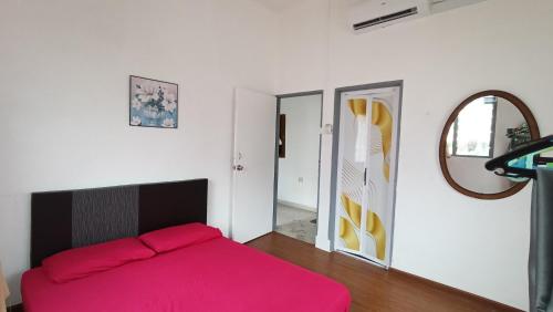 Postel nebo postele na pokoji v ubytování Che Na Homestay Pontian