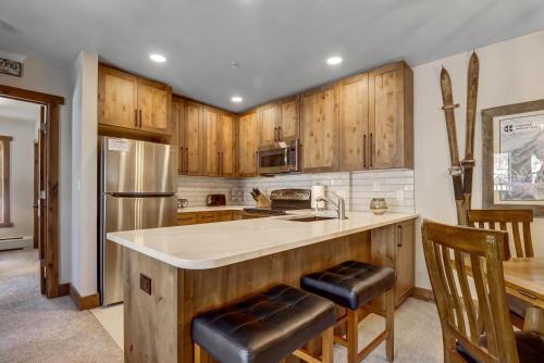 a kitchen with wooden cabinets and a counter top at CS110 Copper Springs condo in Copper Mountain