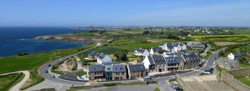 an aerial view of a large house with a road at Hostellerie de la Pointe Saint-Mathieu - SPA & Restaurant in Plougonvelin